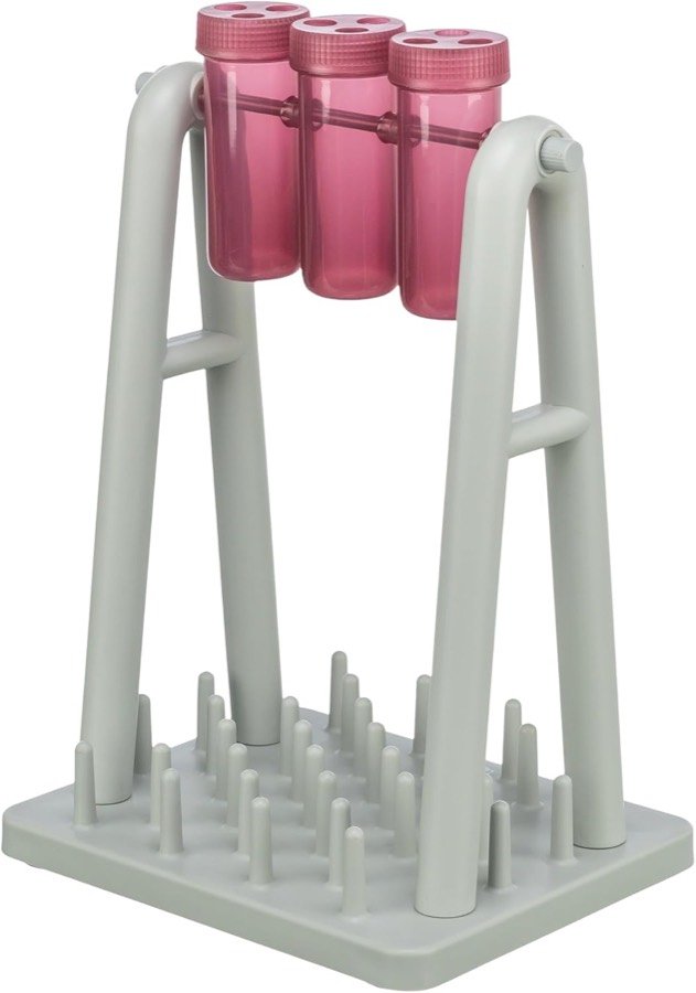 Trixie Cat Activity Turn Around: tres tubos rosas giratorios sobre un soporte gris con pivotes en la base