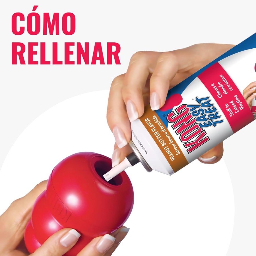 Ver imagen 5 de 6: Manos rellenando el KONG Classic con pasta KONG Easy Treat por el orificio inferior