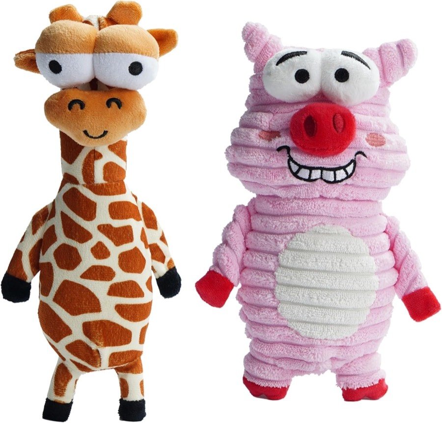 Dos peluches Nocciola de pana: una jirafa de ojos saltones y un cerdito rosa