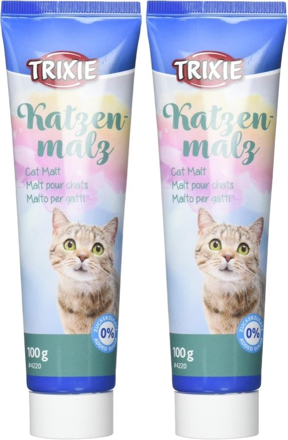 Los dos tubos de 100 gramos de Trixie Katzenmalz, con fondo pastel y un gato atigrado en la etiqueta